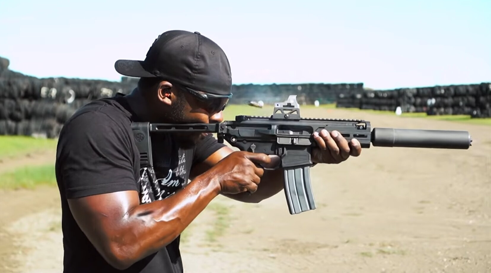 Shooter fires suppressed short-barreled rifle