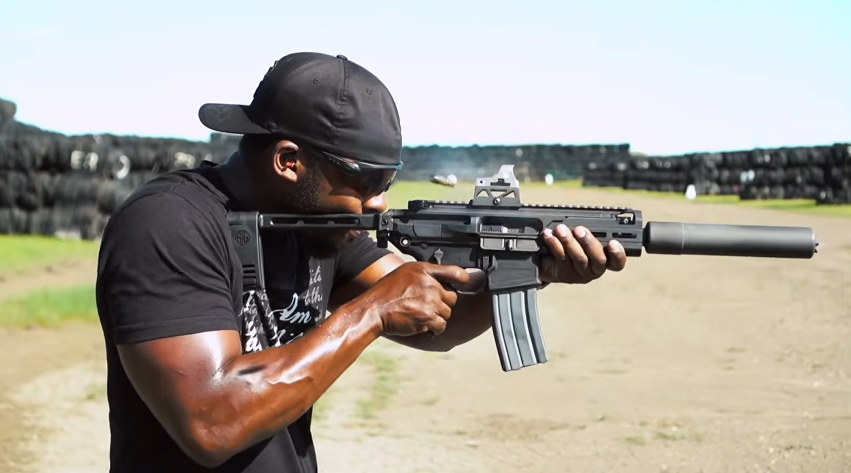 Shooter fires suppressed short-barreled rifle
