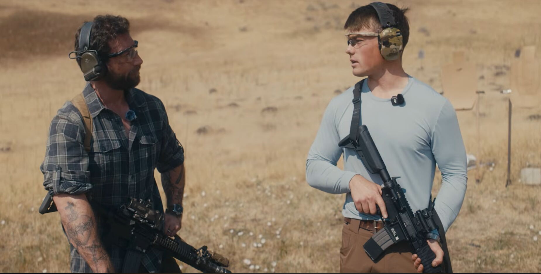 Two shooters holding AR-15 rifles