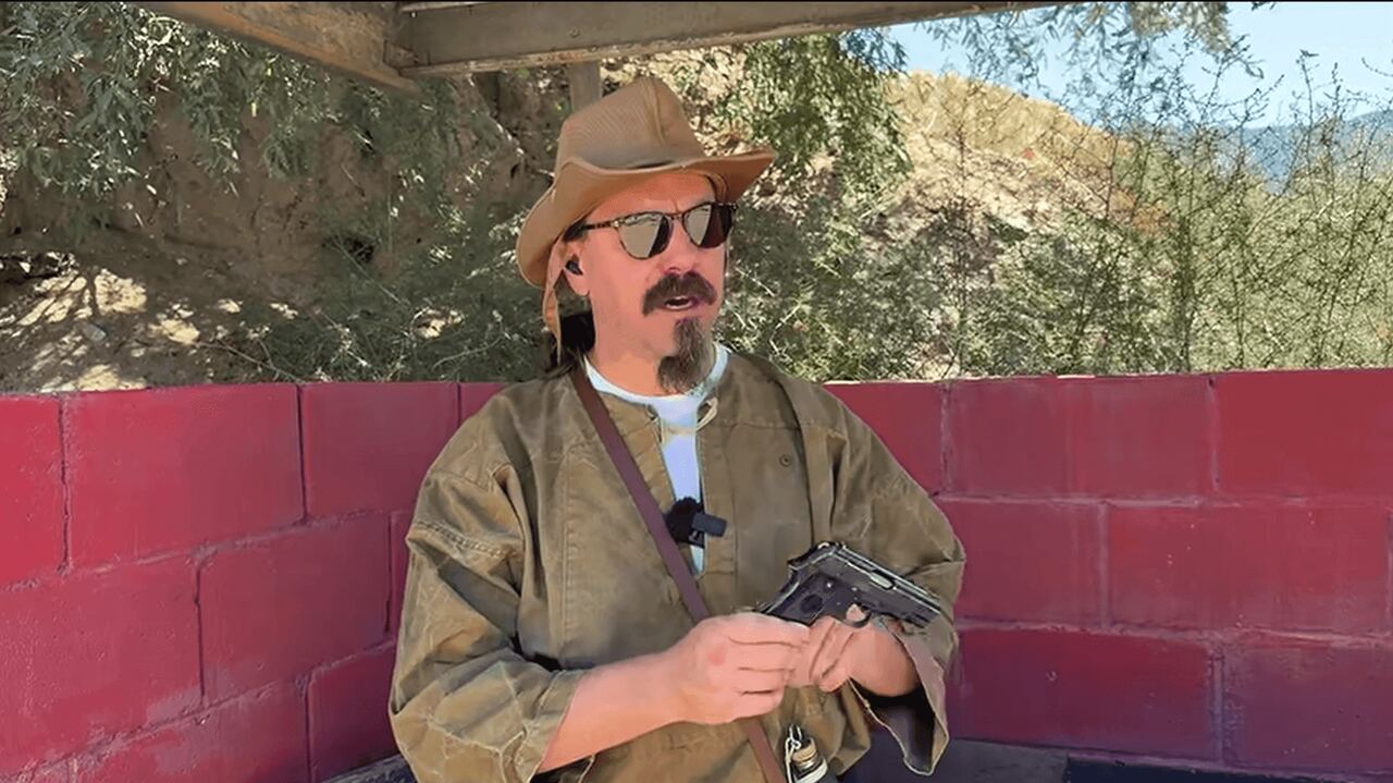 Ian McCollum holding Unique Rr51 pistol
