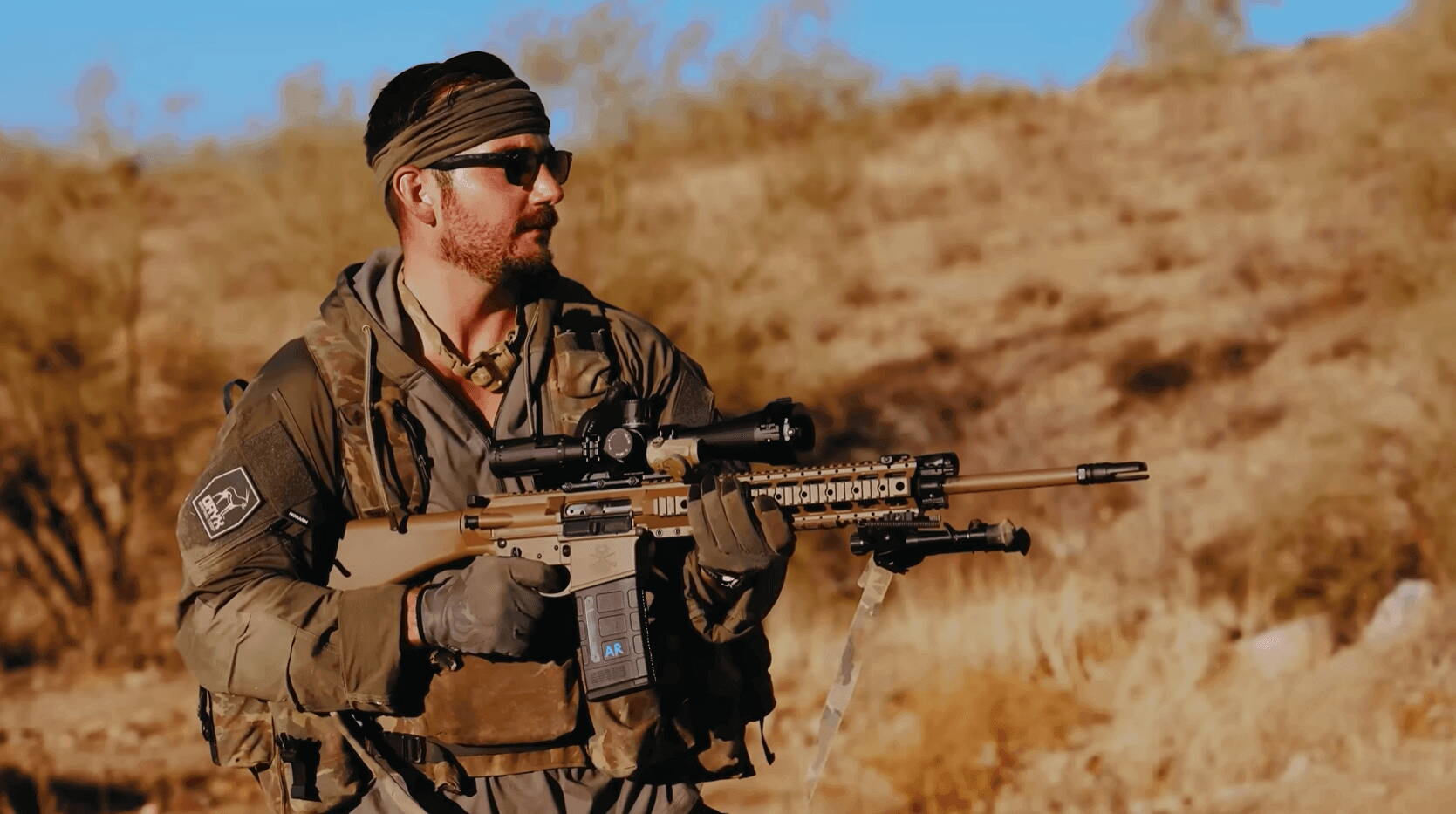 Shooter with scoped AR-pattern rifle