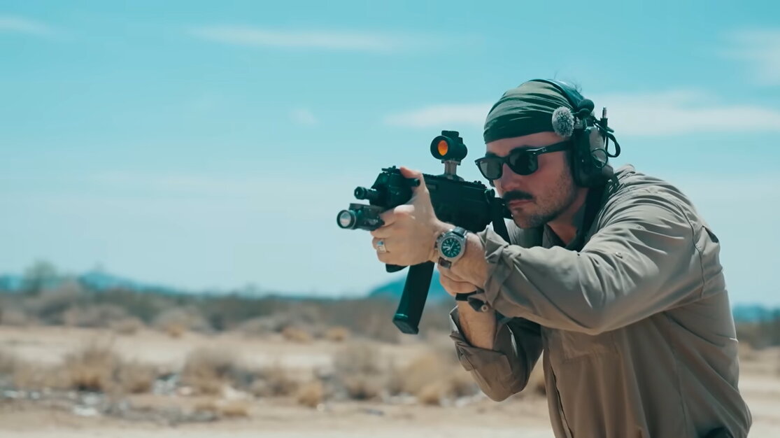 Shooter aiming Springfield Kuna pistol
