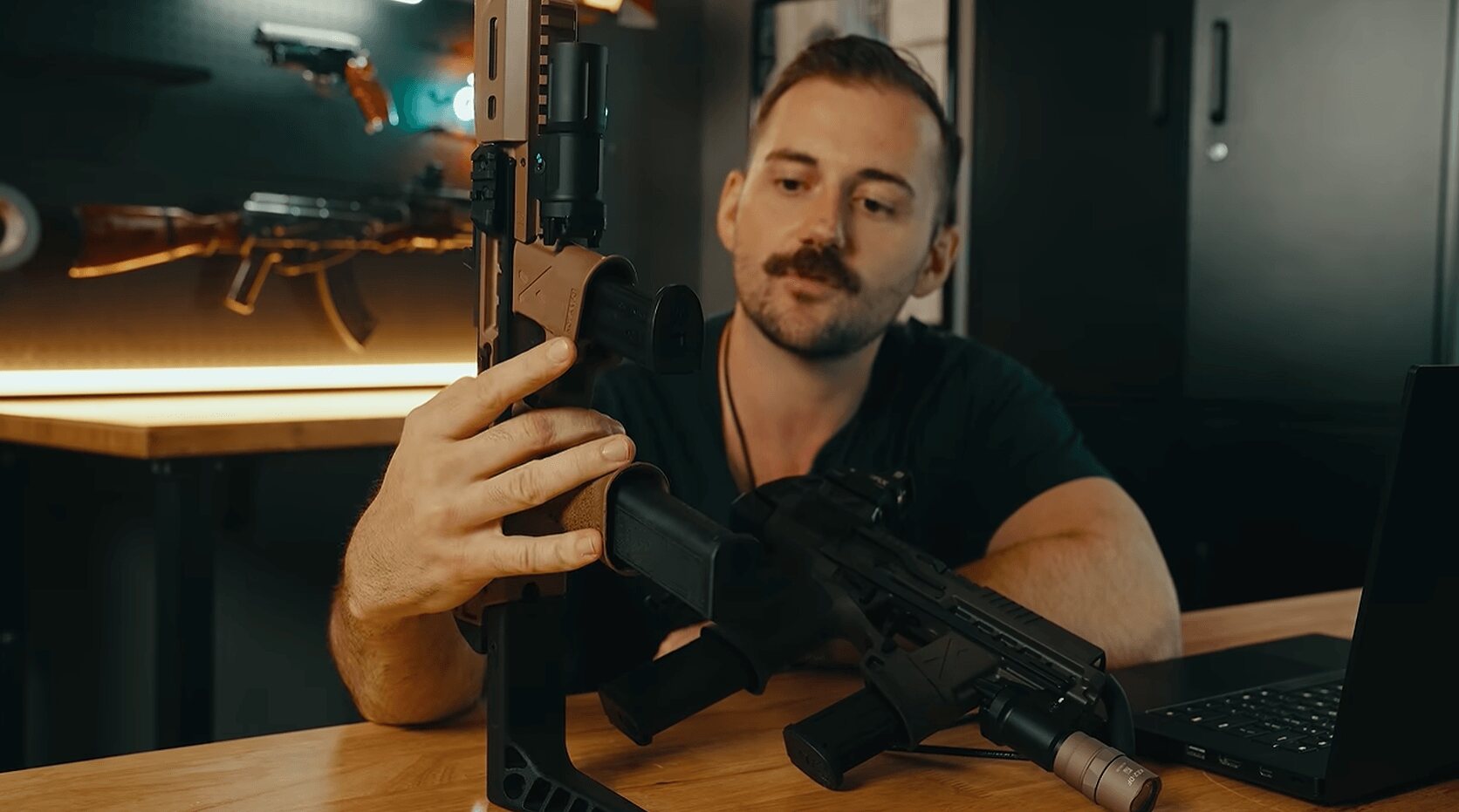 Reviewer holding tan Flux Raider chassis